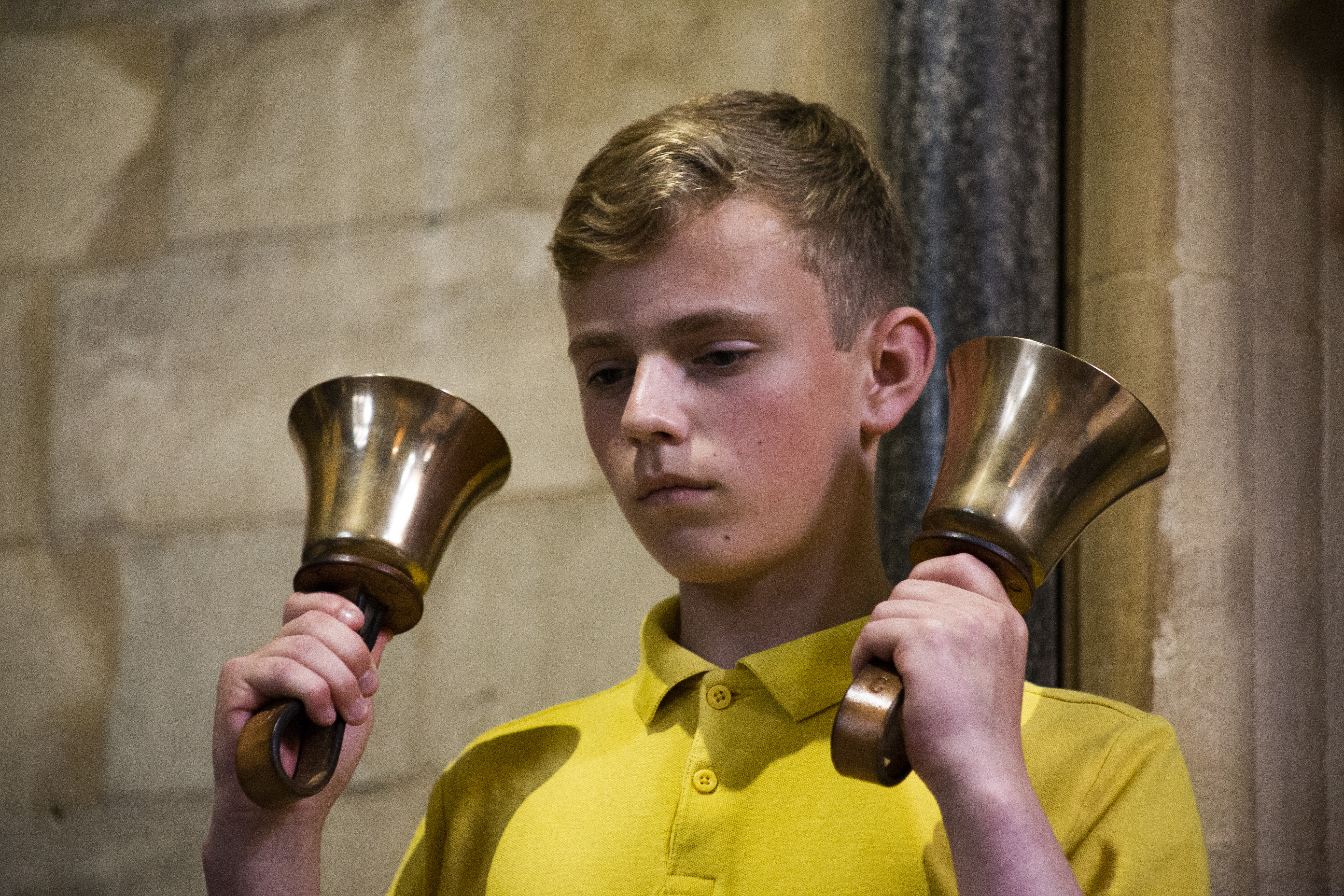 A young ringer playing handbells