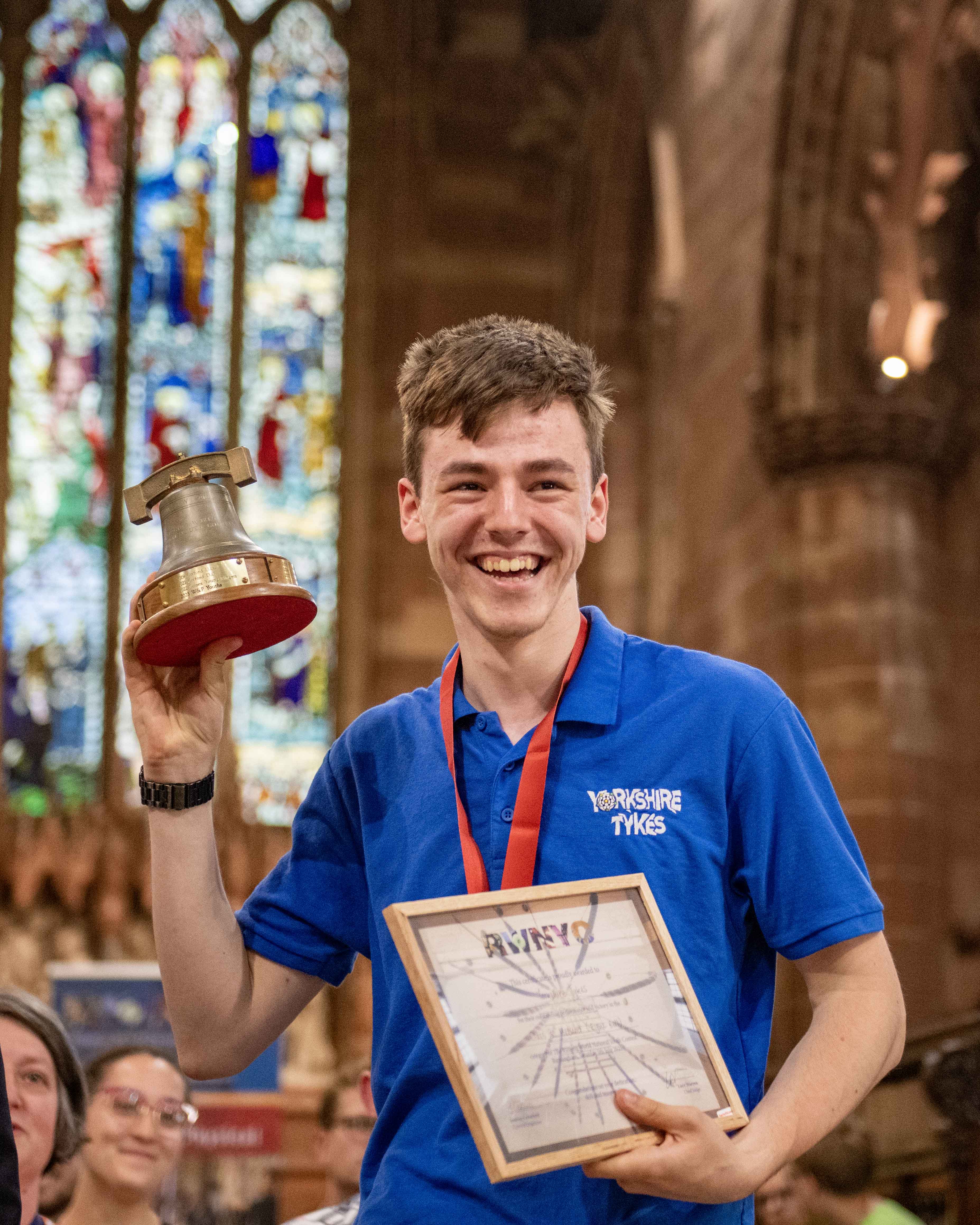 A contest winner holding the trophy